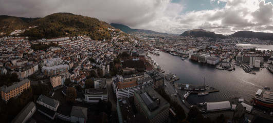 Aerial Drone Panorama View of Bergen City in Norway Scandinavia with Water, Bridges, and Mountains in distance
