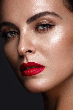 Beautiful girl with a classic make up and red lips. Beauty face.Photo taken in the studio