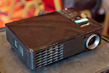 Close up projector in conference room . LCD Projector technology video presentation and home...