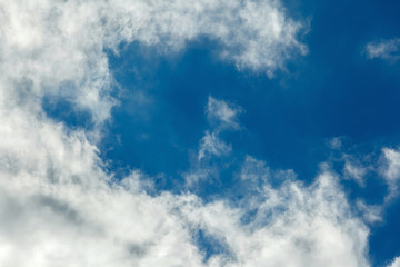 white clouds in a light blue sky