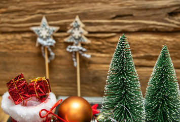 Fototapeta na wymiar Christmas decoration concept-close up of Christmas tree on a wooden background.