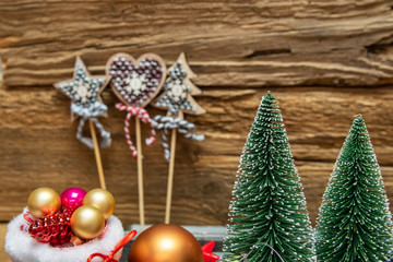 Christmas decoration concept-close up of Christmas tree on a wooden background.