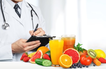 Portrait of doctor with folder and green