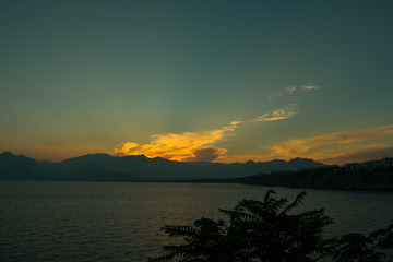 Fototapeta na wymiar beautiful sunset above sea and taurus mountains in Antalya, Turkey
