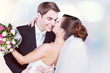 Happy young wedding couple embracing