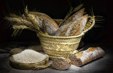 Fresh wholemeal bread with flour and wheat ears