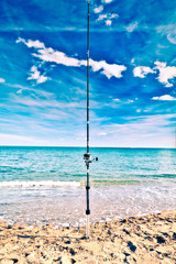 Fishing rod nailed to the seashore