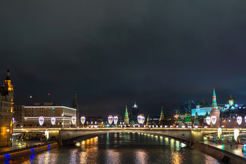 Fototapeta na wymiar Night view of the Moscow Kremlin and Moskvoretskaya embankment with New year illumination, Moscow, Russia