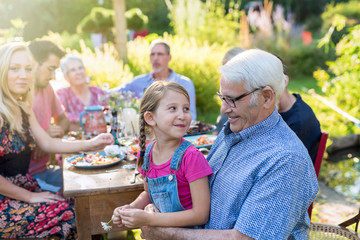  Family picnic closeup on a grandfather and his granddaughter