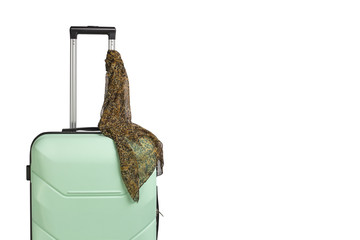 Plastic travel case and scarf the handle on a white background. Concept of travel, business trips, trips to visit friends and relatives