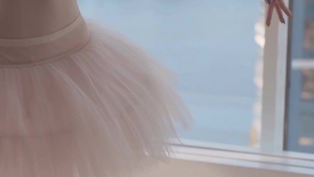 close-up. professional costume of a ballet dancer. White ballet tutu. slowmotion