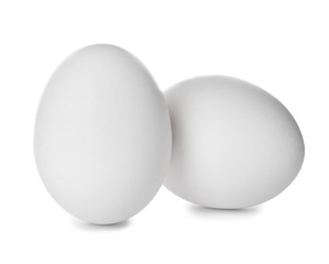 Few raw chicken eggs on white background