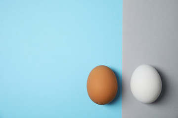 Raw chicken eggs on color background, top view. Space for text