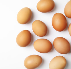 Raw chicken eggs on white background, top view