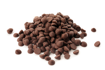 Pile of delicious dark chocolate chips on white background