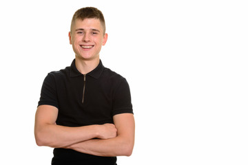 Young happy Caucasian man smiling with arms crossed