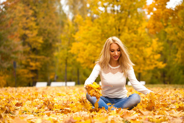 Young blonde woman in blue jeans