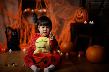 Toddler girl dressed up playing in Halloween party