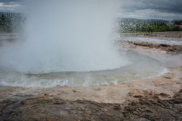 Eruption of Strokkur geyser in Iceland in summer -close-up