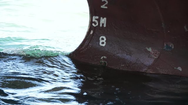 Ship's draft marks. Boat in port.