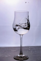 Close up view of splashing water in glass isolated. Black and white. Beautiful backgrounds.