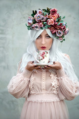 Young lady drinking tea