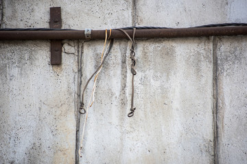 Electrical wire is attached to a metal pipe