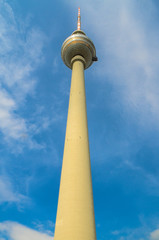 Obraz premium Television tower against the blue sky with clouds in Berlin, Germany