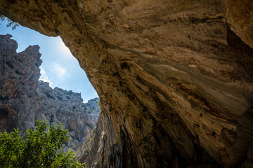 Beautiful huge canyon viewed from below in the cave. Shot in Gola Su Gorropu canyon, Sardinia, Italy -  important natural site in Sardinia. 