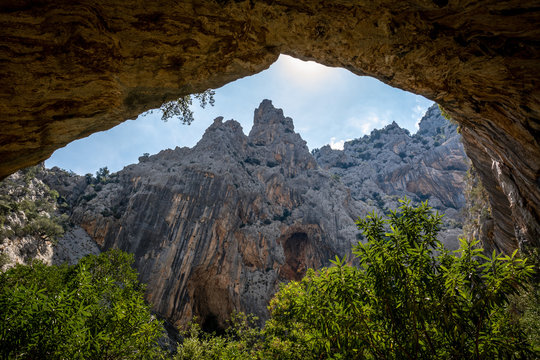 Beautiful huge canyon viewed from below in the cave. Shot in Gola Su Gorropu canyon, Sardinia, Italy - important natural site in Sardinia. 