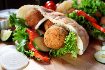 Falafel and fresh vegetables in pita bread
