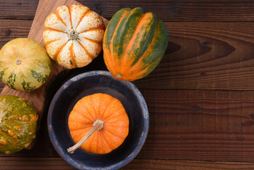High angle shot of a group of ornamental pumpkins and gourds