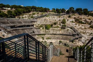 Anfiteatro Romano di Cagliari/ Roman amphitheatre of Cagliari ruins on a sunny day with blue sky....
