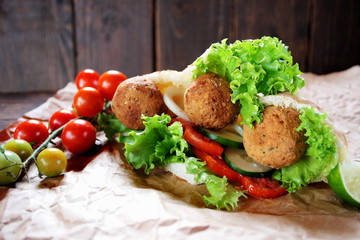 Falafel and fresh vegetables in pita bread