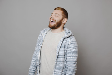 Handsome guy laughing with closed eyes