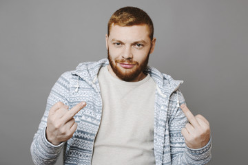 Ginger man showing middle finger