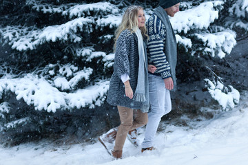 Happy young woman walking in winter time