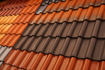 Glossy, matte and textured surface. Different colored roof tiles.