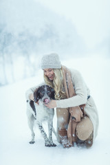 Happy young woman walking in winter time