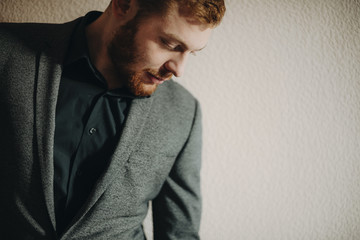 Obraz premium Handsome businessman looking down
