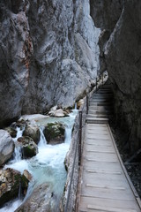 Mountain hiking footbridge at Höllentalklamm canyon near river