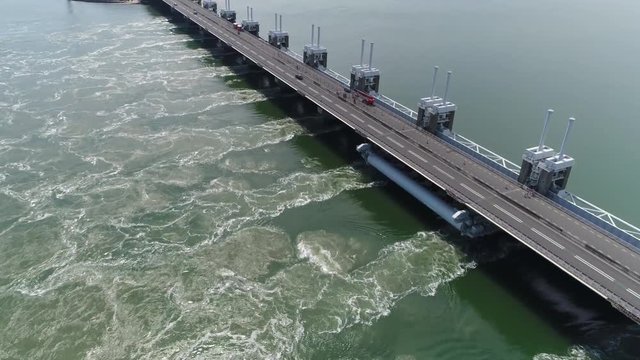 Aerial footage of Eastern Scheldt storm surge barrier in dutch Oosterscheldekering is largest of Delta Works series of dams and barriers designed to protect Netherlands from flooding 4k quality