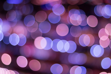 Abstract background city lights at night. Street light night market blur color bokeh background.