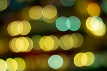 Abstract background city lights at night. Street light night market blur color bokeh background.