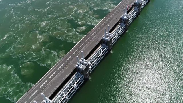 Aerial bird view footage Eastern Scheldt storm surge barrier in dutch Oosterscheldekering is largest of Delta Works series of dams and barriers designed to protect Netherlands from flooding 4k quality