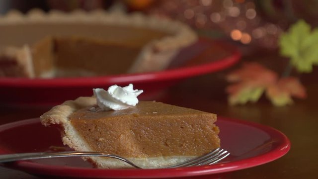 place fork by pie slice with cream