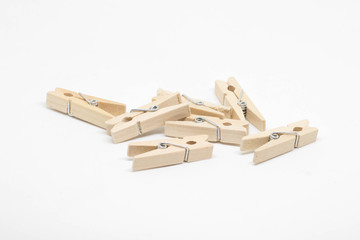 Wooden clothes clips isolated on white background.