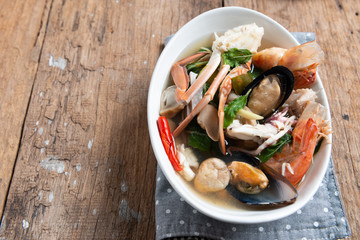 Spicy Seafood Soup on white dish , thai cuisine
