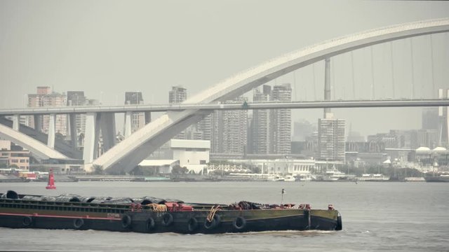 Sunny and hot afternoon in the the West Bund park along the Waitan river and The Bund in Shanghai, China.