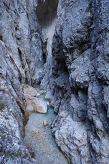 Steep mountain canyon with river and crystal clear water at Höllentalklamm in the German Alps